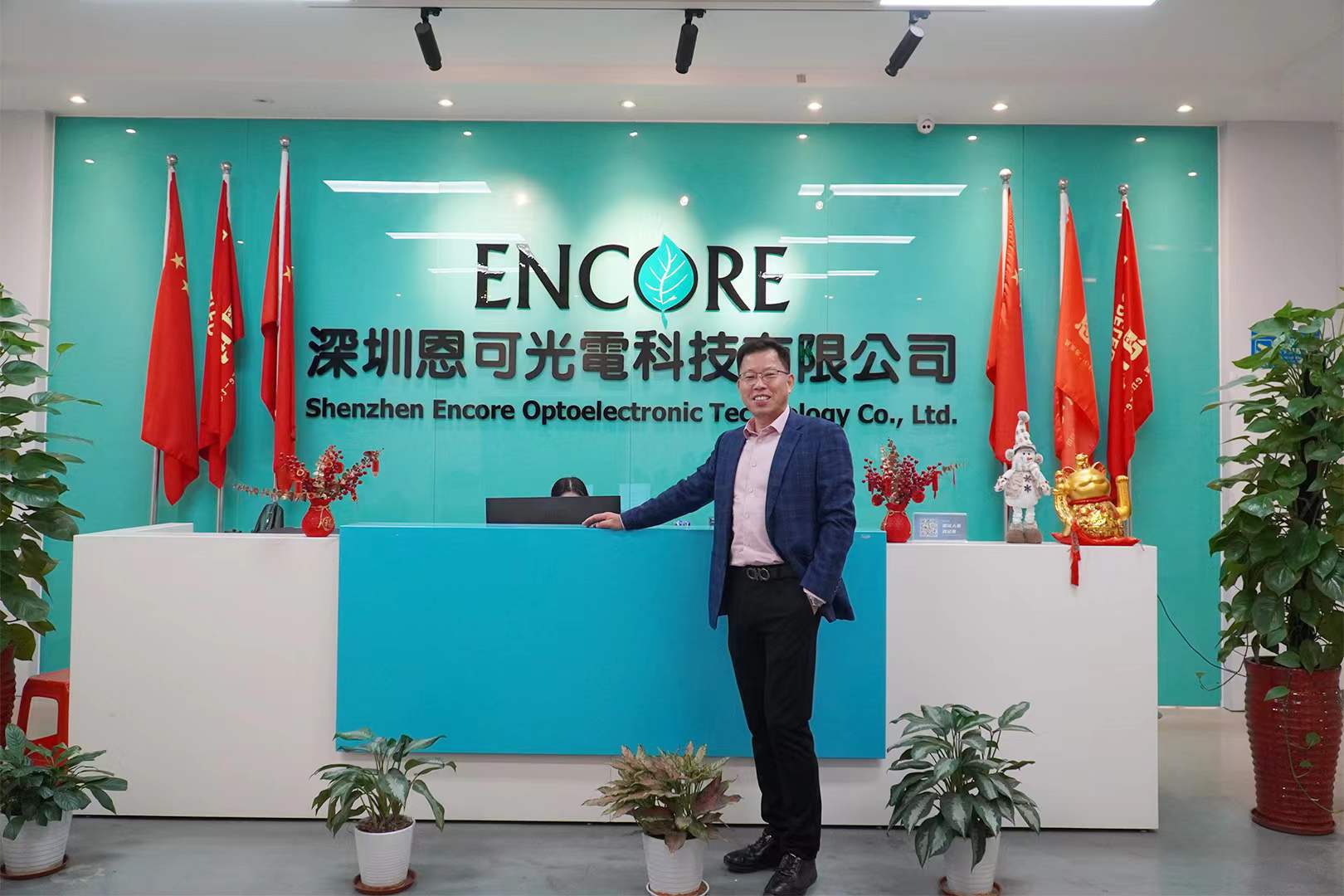 Rocky Wong in formal executive business suit during international expansion, 2024